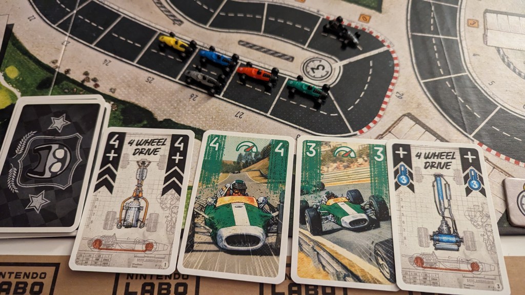 A played set of four cards in Heat. Featuring two of the upgrade cards either side of two regular speed cards.